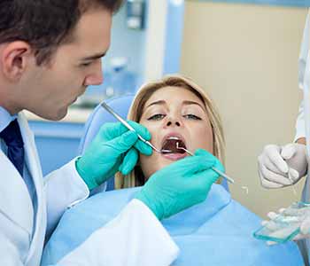 Patient getting tooth extracted at a dental